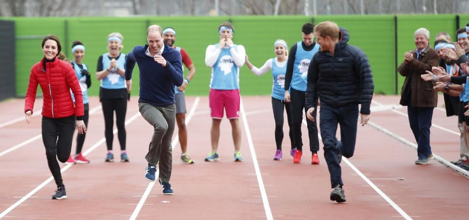 Britain's Prince William, second left, Kate, the Duchess of Cambridge, left, and Prince Harry take part in a relay race, during a training event to promote the charity Heads Together, at the Queen Elizabeth II Park in London, Sunday, Feb. 5, 2017. (AP Photo/Alastair Grant, Pool)