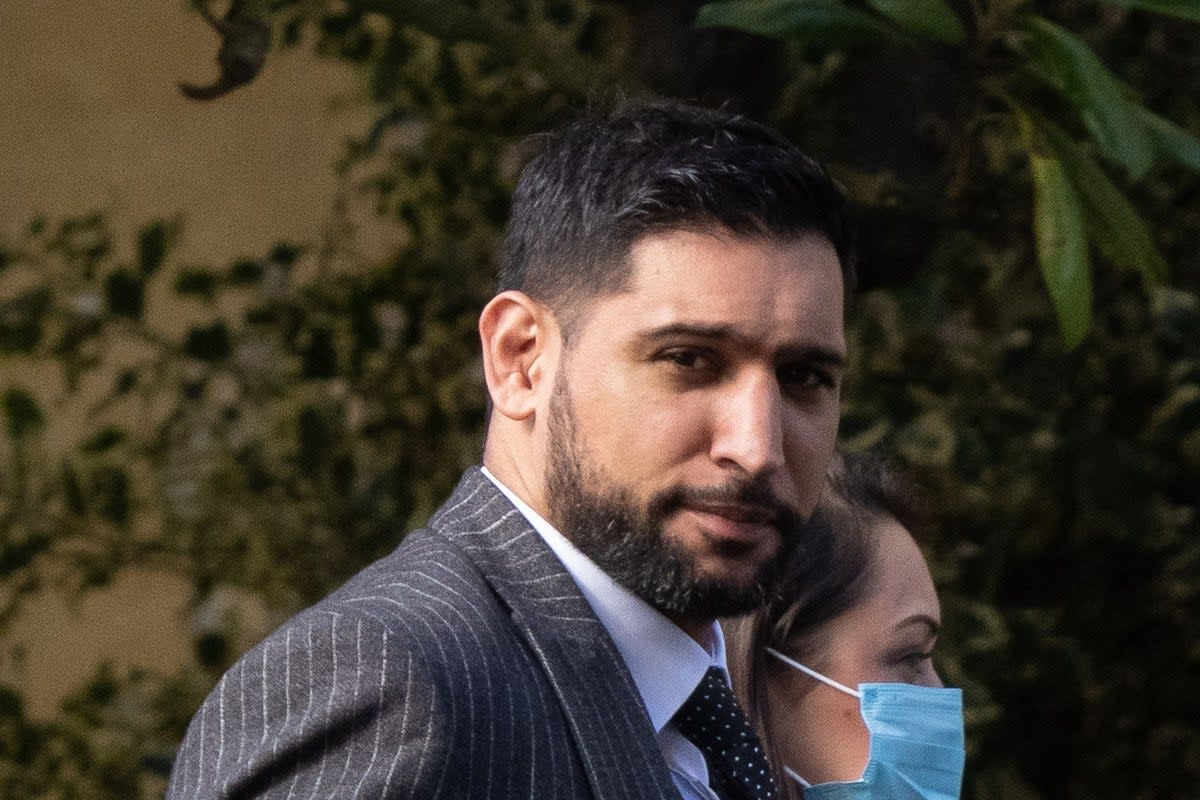 Former world boxing champion Amir Khan arrives at Snaresbrook Crown Court in east London, where three men were accused of robbing the boxer of a diamond watch at gunpoint (Jeff Moore/PA) (PA Wire)