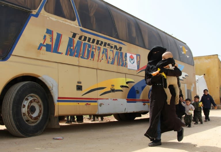 Syrians evacuated from the rebel-held town of Harasta in Eastern Ghouta arrive at a camp for displaced people in Maaret al-Ikhwan, in Syria's largely rebel-held Idlib province on March 23, 2018