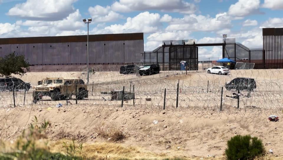 <div class="inline-image__caption"><p>Members of the National Guard watch over the river bank at border marker 40 in Ciudad Juárez on May 13, a day after Title 42 ended.</p></div> <div class="inline-image__credit">Luis Chaparro</div>