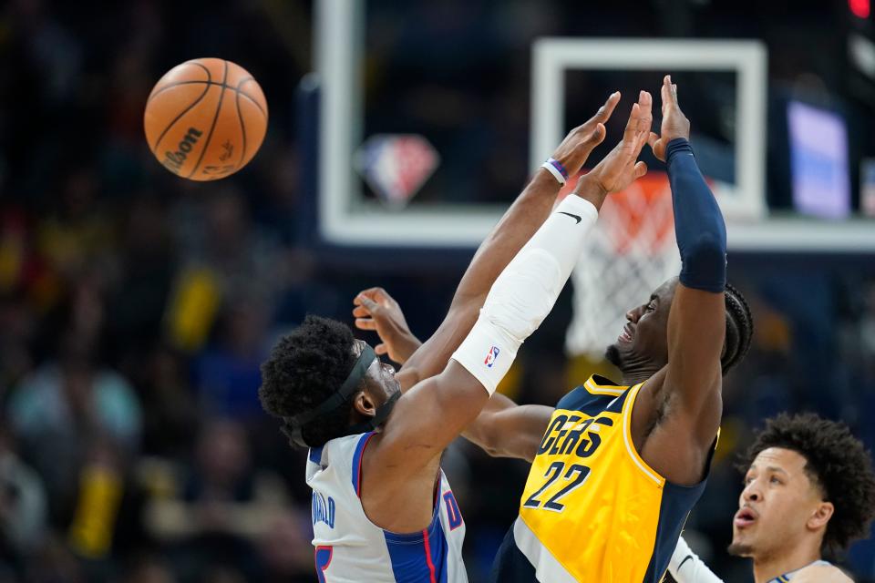 Indiana Pacers' Caris LeVert (22) makes a pass against Detroit Pistons' Hamidou Diallo (6) during the first half at Gainbridge Fieldhouse in Indianapolis on Thursday, Dec. 16, 2021.