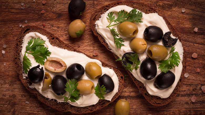 bread with cream cheese, olives