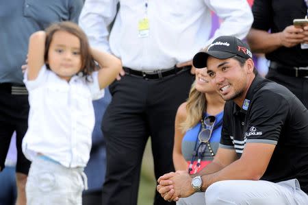 Aug 16, 2015; Sheboygan, WI, USA; Jason Day celebrates winning the son Dash Day after winning the 2015 PGA Championship golf tournament at Whistling Straits. Mandatory Credit: Thomas J. Russo-USA TODAY Sports