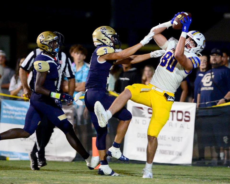 Serra tight end Cole Harrison catches a touchdown pass over two Central Catholic defenders during a game between Central Catholic and Serra at Central Catholic High School in Modesto, California, on September 8, 2023.