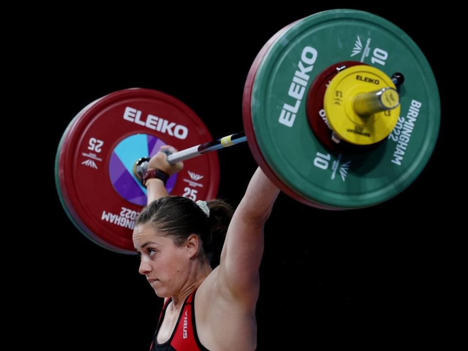 Canada's Maude Charron, pictured during the 2022 Commonwealth Games on Aug. 1, won a bronze medal in the women's 59-kilogram weight class on Thursday at the IWF weightlifting world championships in Bogota, Colombia. (Al Bello/Getty Images - image credit)