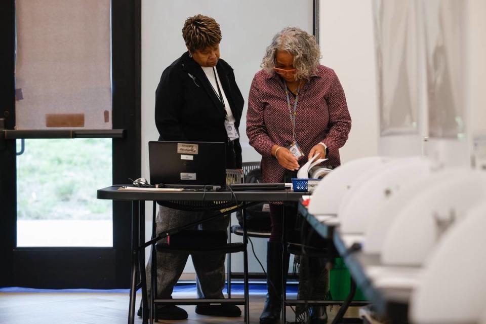 Election official Kay Patterson, left, looks through paperwork with site coordinator Frankie Jenkins at Eastway Regional Recreational Center in Charlotte, NC on February 28, 2024.