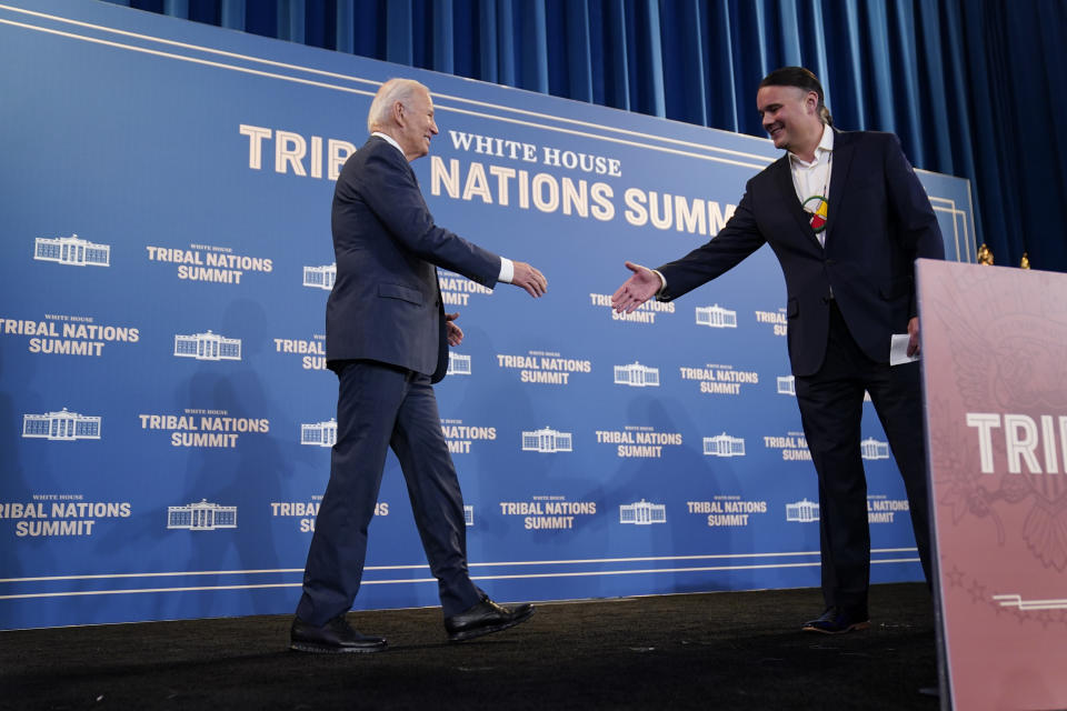 President Joe Biden shakes hands with Assistant Secretary-Indian Affairs Bryan Newland, Department of the Interior, as he arrives to speak at the White House Tribal Nations Summit at the Department of the Interior, Wednesday, Dec. 6, 2023, in Washington. (AP Photo/Evan Vucci)