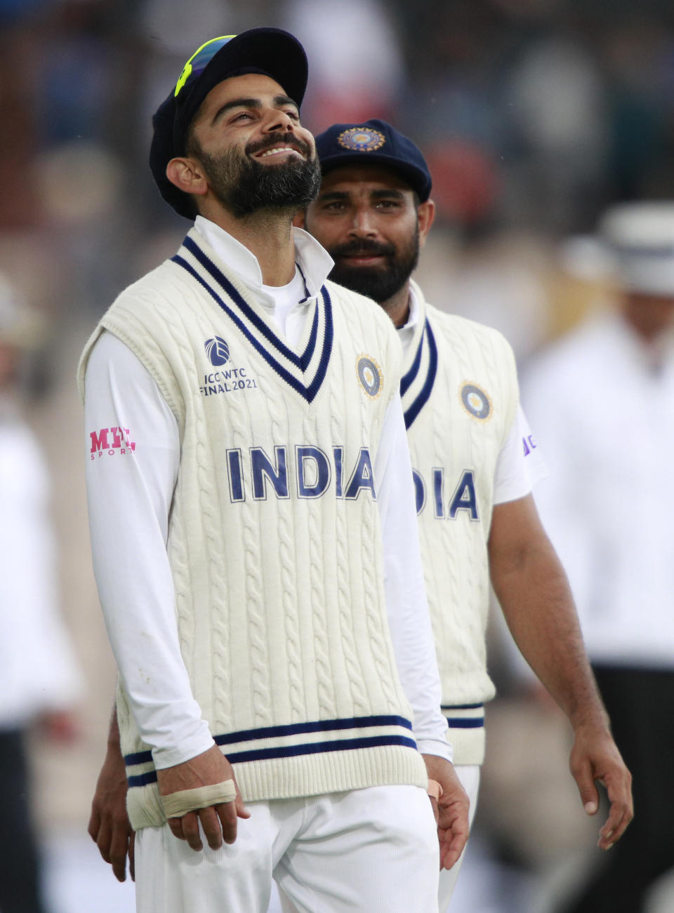 India's captain Virat Kohli, left, and Mohammed Shami leave the field at the end of play on the third day of the World Test Championship final cricket match between New Zealand and India, at the Rose Bowl in Southampton, England, Sunday, June 20, 2021. (AP Photo/Ian Walton)