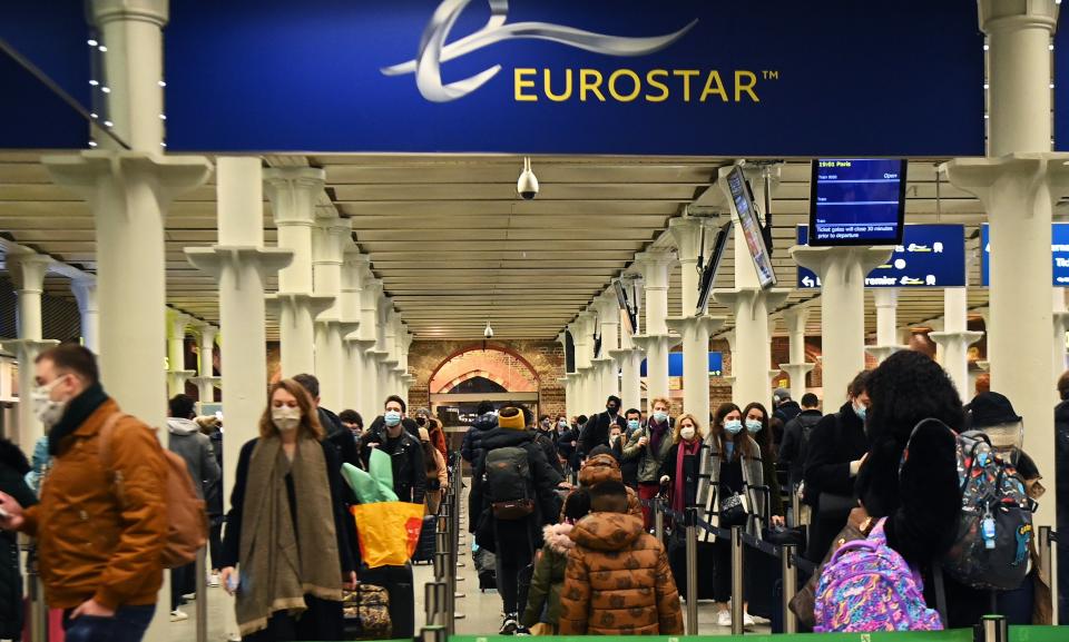 Passengers queue to board the Eurostar to Paris from Kings Cross St Pancras, shortly before France shuts its border to the UK at midnight on 20 December, 2020.  (EPA)