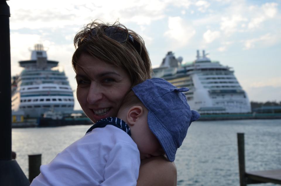 Mom holding baby on a cruise