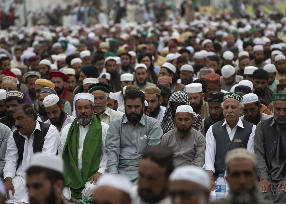Supporters of a Pakistani radical Islamist party 'Jamiat Ulema-e-Islam' offer Friday prayers during an anti-government march, in Islamabad, Pakistan, Friday, Nov. 1, 2019. Thousands of members of a radical Islamist party have camped out in Pakistan's capital, demanding the resignation of Prime Minister Imran Khan over economic hardships. (AP Photo/B.K. Bangash)