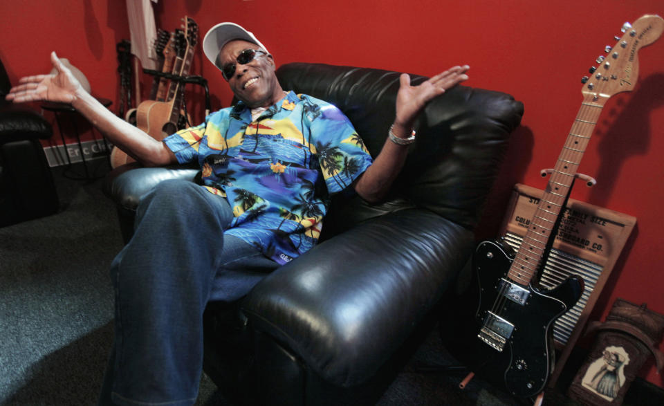 In this Aug. 3, 2012 photo, blues legend Buddy Guy speaks about his new book, "When I left Home" in the office of his blues club Buddy Guy's Legends in Chicago's South Loop.. (AP Photo/M. Spencer Green)