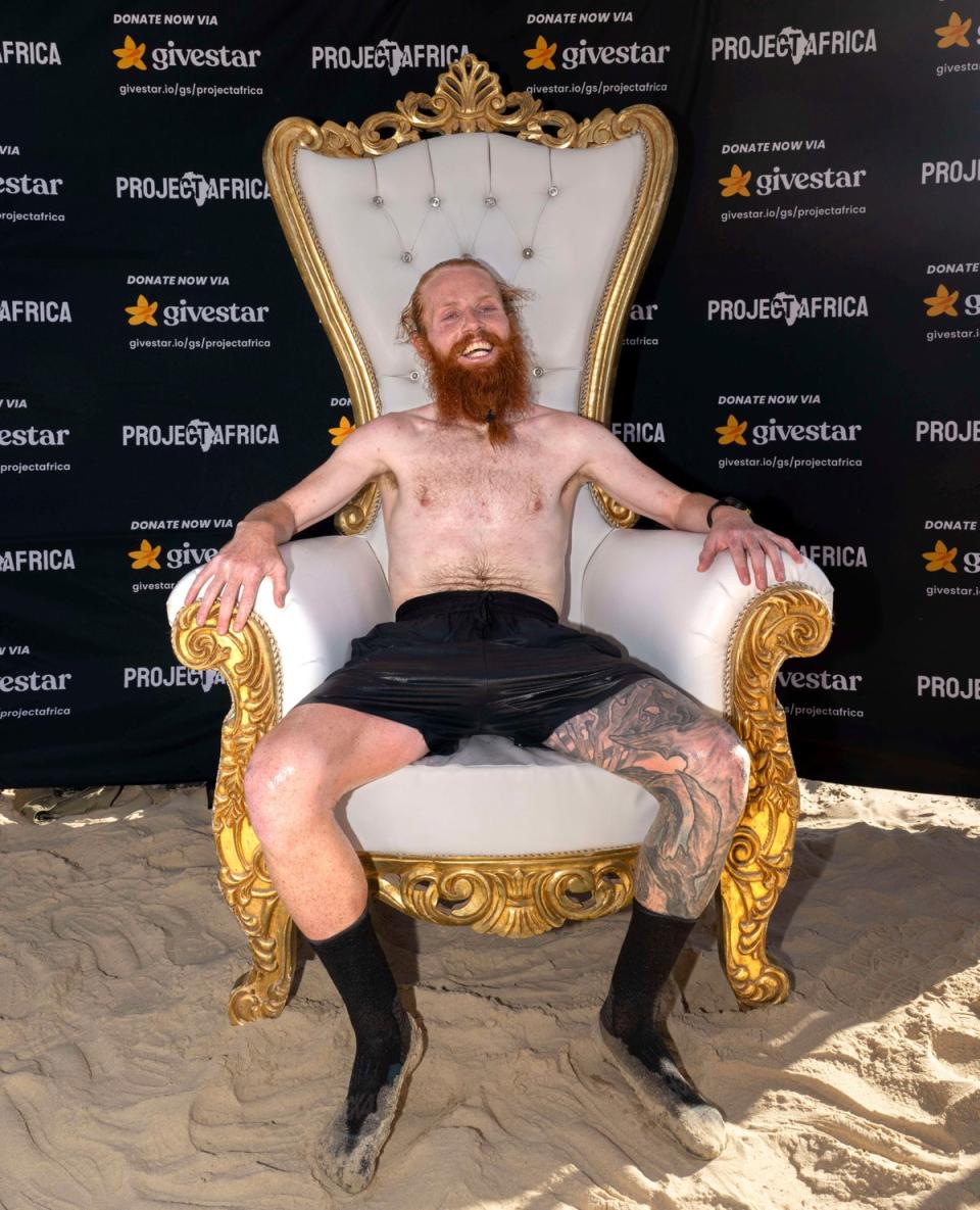 Russ celebrated his victory by sitting on a gold throne. (Copyright 2024 The Associated Press. All rights reserved.)