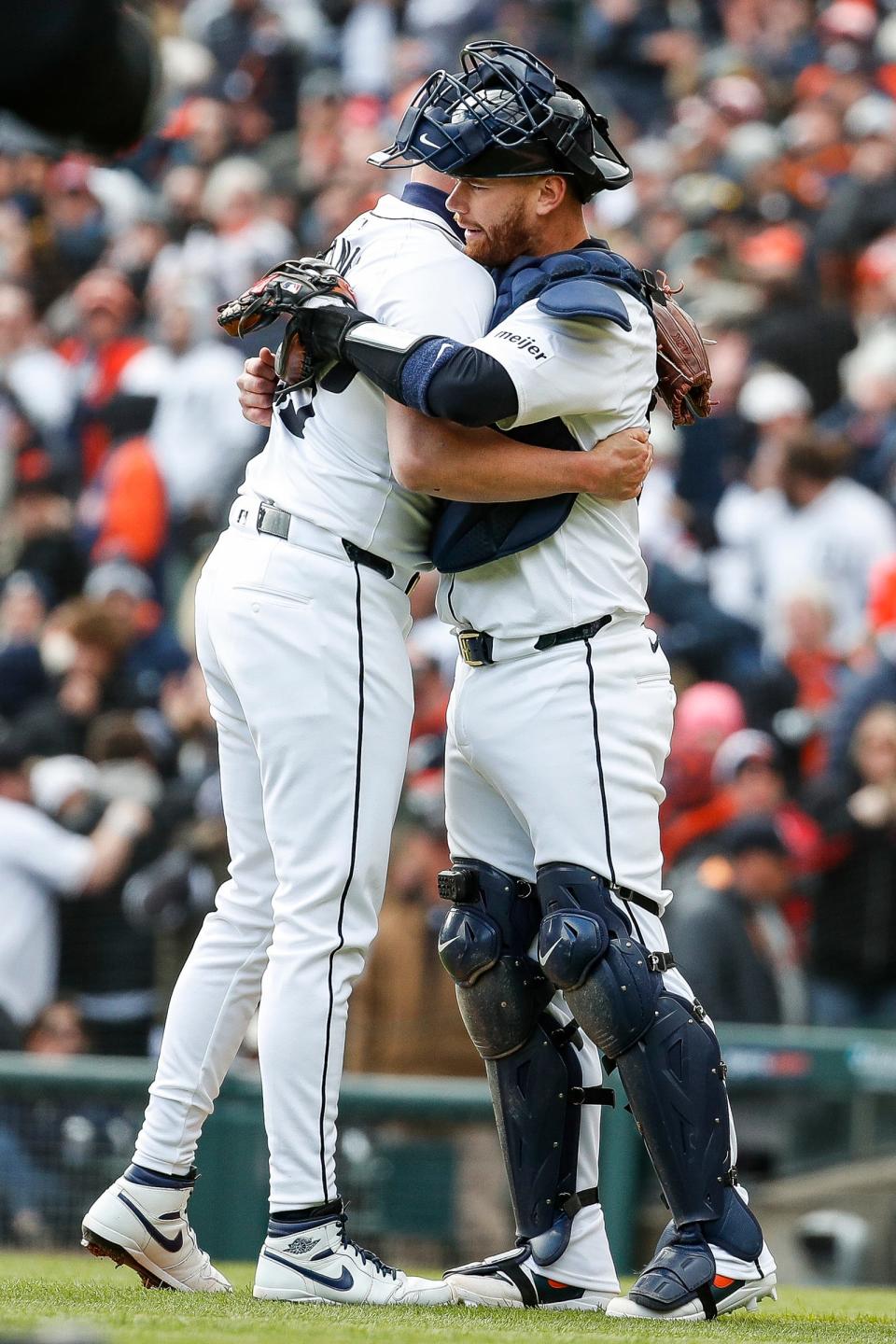 Detroit Tigers pitcher Alex Lange (55) hugs catcher Carson Kelly (15) after Tigers win 5-4 over Oakland Athletics at the home opening day at Comerica Park in Detroit on Friday, April 5, 2024.