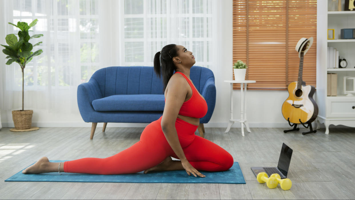 Black woman stretching and exercising