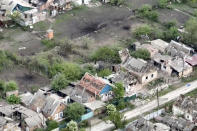 This drone footage obtained by The Associated Press shows the village of Ocheretyne, a target for Russian forces in the Donetsk region of eastern Ukraine. Ukraine’s military has acknowledged the Russians have gained a “foothold” in Ocheretyne, which had a population of about 3,000 before the war, but say fighting continues. No people could be seen in the footage, and no building in Ocheretyne appeared to have been left untouched by the fighting. (Kherson/Green via AP)