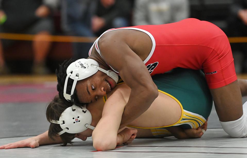 Moon's Khyvon Grace and Carlynton's Bryce Rodriguez compete in the 132 pound weight class during the Ed Driscoll MAC Wrestling Tournament, Saturday, Jan. 8, at Ambridge Area High School.