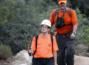 <p>Members of the Tonto Rim Search and Rescue team look along the banks of the East Verde River for victims of a flash flood, Sunday, July 16, 2017, in Payson, Ariz. (AP Photo/Ralph Freso) </p>