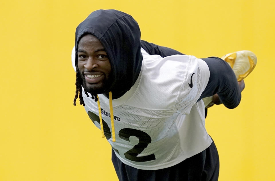 FILE - Steelers running back Najee Harris stretches during NFL football practice Tuesday, Aug. 30, 2022, in Pittsburgh. Harris has taken on more of a leadership role in his second season. His teammates have noticed, voting him a co-captain at age 24.(Matt Freed/Pittsburgh Post-Gazette via AP, File)