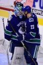 Jan 18, 2019; Vancouver, British Columbia, CAN; Vancouver Canucks defenseman Alexander Edler (23) congratulates goaltender Thatcher Demko (35) for the win over the Buffalo Sabres during the third period at Rogers Arena. Mandatory Credit: Anne-Marie Sorvin-USA TODAY Sports