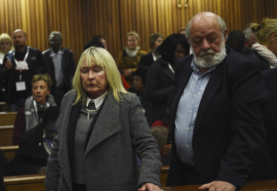 FILE — The parents of the late Reeve Steenkamp, June, left, and Barry Steenkamp, right, leave the High Court in Pretoria, South Africa, Wednesday, July 6, 2016. Eight years after he shot dead his girlfriend, Pistorius is up for parole, but first he must meet with her parents as part of the parole procedure. A parole hearing for Pistorius was scheduled for last month and then canceled, partly because a meeting between Pistorius and Steenkamp's parents, Barry and June, had not been arranged, lawyers for both parties told The Associated Press on Monday, Nov. 8, 2021. (Masi Losi/Pool Photo via AP, file)