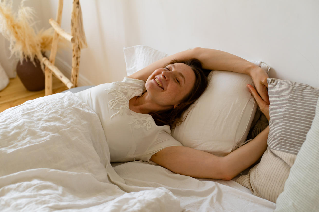 woman in bed waking up