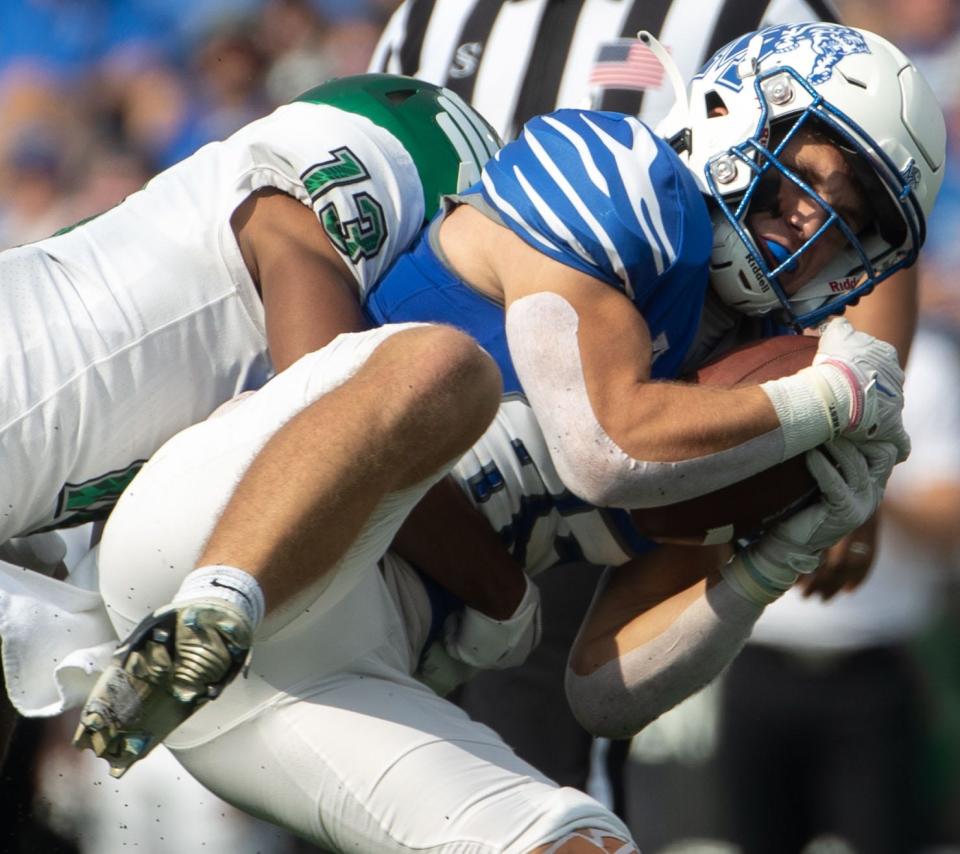 North Texas Mean Green defensive back Logan Wilson (13) makes a tackle vs. Memphis. Wilson is now a UC Bearcat.