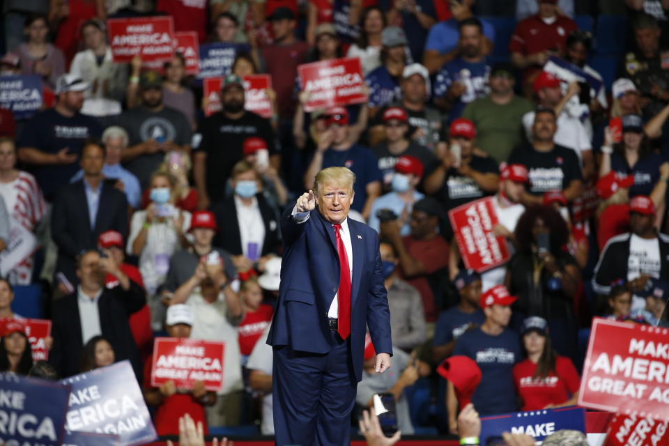 FILE - In this June 20, 2020, file photo, President Donald Trump speaks during a campaign rally at the BOK Center in Tulsa, Okla. The coronavirus pandemic isn't going away anytime soon, but campaigns are still forging ahead with in-person organizing. The pandemic upended elections this year, forcing campaigns to shift their organizing activities almost entirely online and compelling both parties to reconfigure their conventions. (AP Photo/Sue Ogrocki, File)