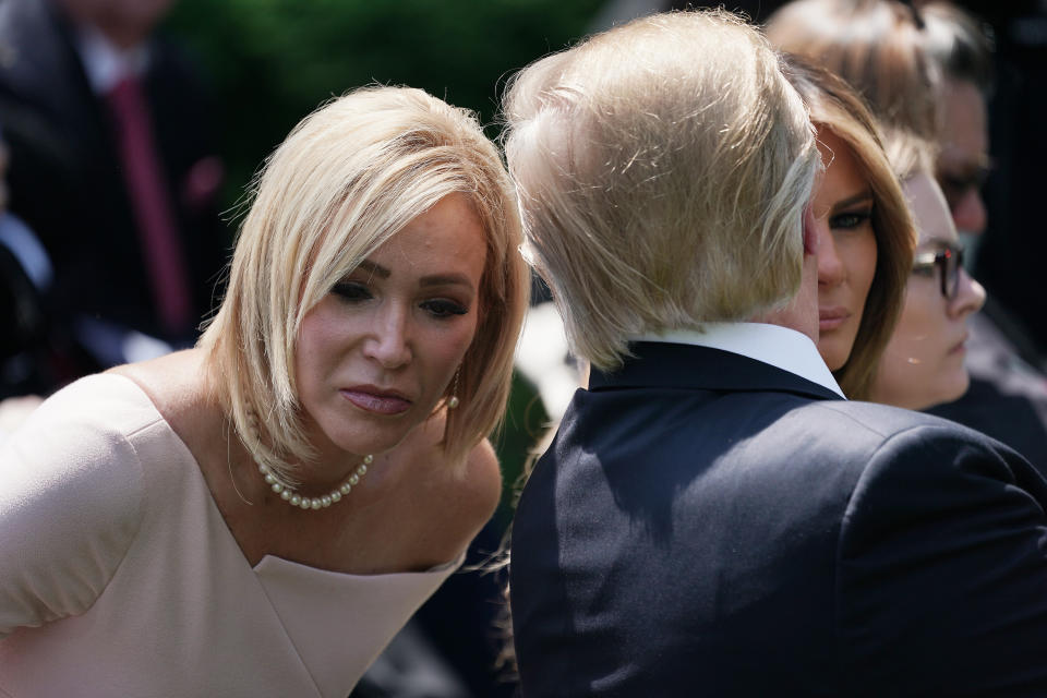 President Donald Trump speaks to Paula White, his spiritual adviser, during a National Day of Prayer service in the Rose Garden at the White House on May 2, 2019. (Photo: Chip Somodevilla via Getty Images)