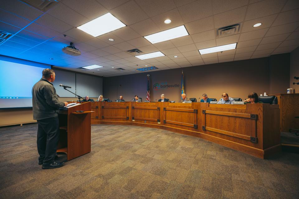 Bartlesville CFO Jason Muninger presents information on utility rate increases to the Bartlesville City Council on Monday.  April 4, 2022