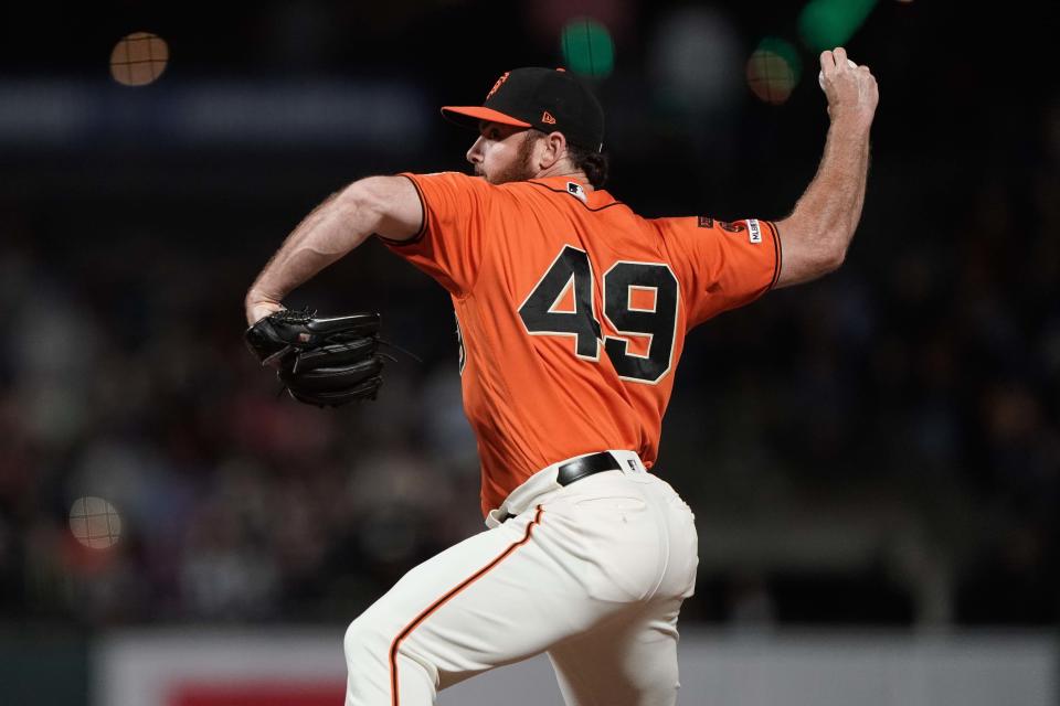 Jul 19, 2019; San Francisco, CA, USA; San Francisco Giants relief pitcher Sam Dyson (49) pitches against the New York Mets during the tenth inning at Oracle Park. Mandatory Credit: Stan Szeto-USA TODAY Sports