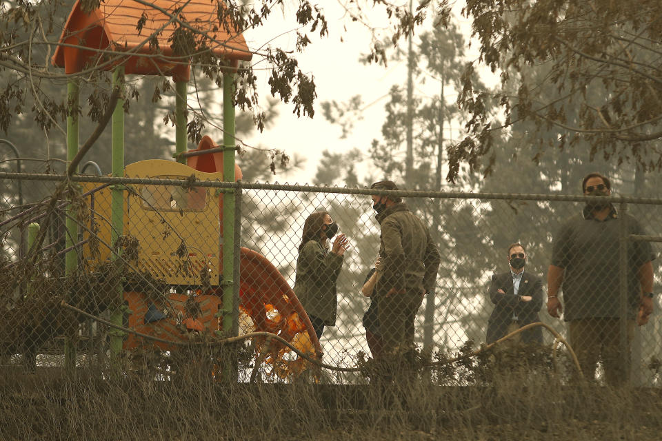 California Gov. Gavin Newsom and Democratic vice presidential candidate Sen. Kamala Harris, D-Calif., talk as they asses the damage during the Creek Fire at Pine Ridge Elementary, Tuesday, Sept. 15, 2020, in Auberry, Calif. (AP Photo/Gary Kazanjian)