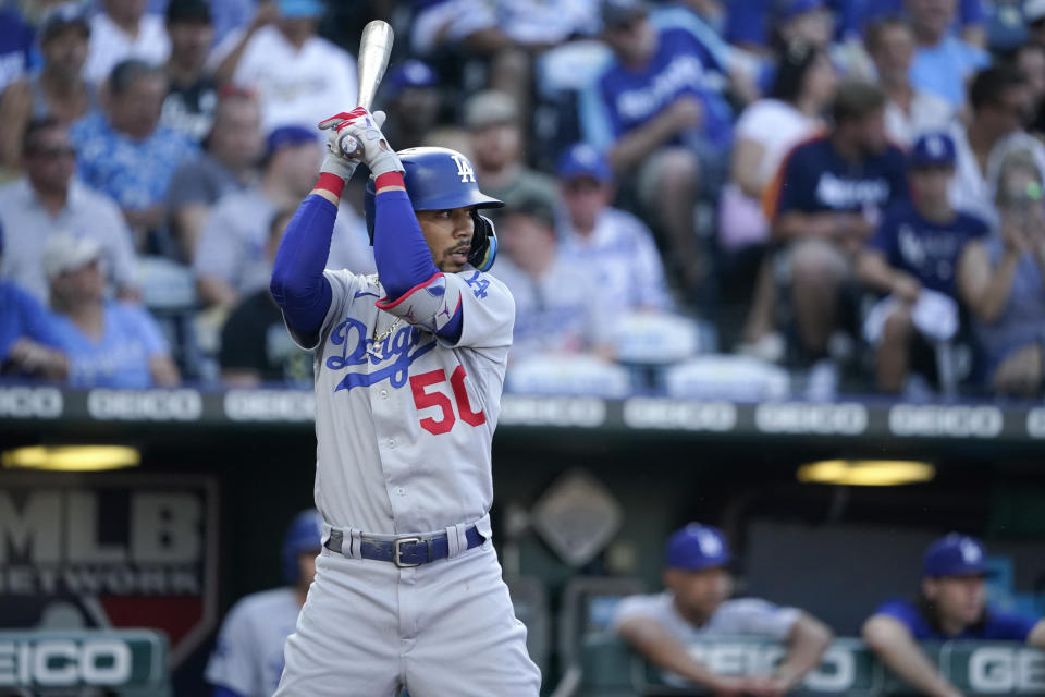 Mookie Betts #50 of the Los Angeles Dodgers bats against the Kansas City Royals in the first inning of an MLB game at Kauffman Stadium