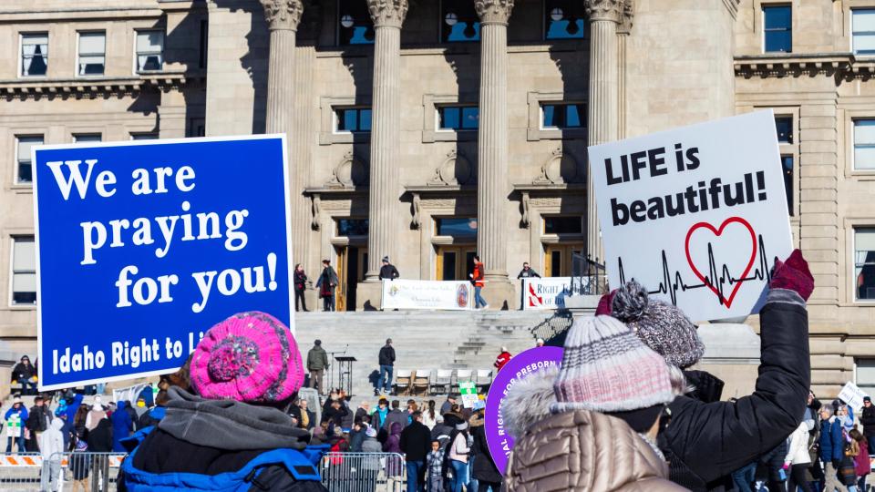 When partisanship gains momentum, people begin to advocate for legislation defining marriage, reproductive rights and other issues in ways that reflect narrow private and religious values. In this file photo, people walk to the Idaho Capitol Building carrying anti-abortion signs for the Boise March for Life rally, Saturday, June 21, 2023. A rural hospital in Sandpoint, Idaho, will stop delivering babies, citing recently passed state laws criminalizing medical care, among other reasons.