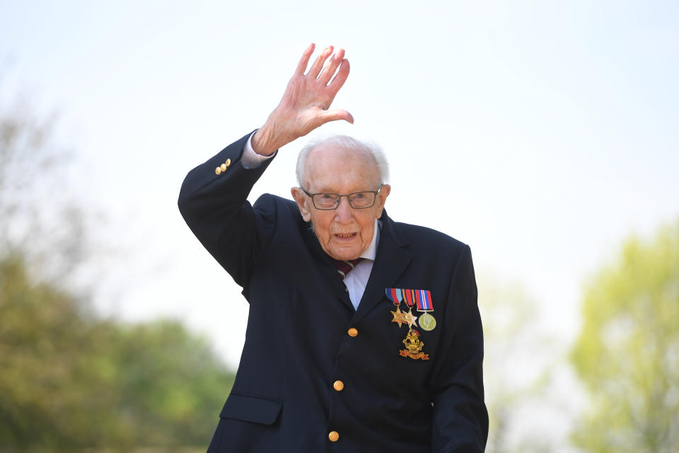 File photo dated 16/04/2020 of the then 99-year-old war veteran Captain Tom Moore at his home in Marston Moretaine, Bedfordshire, after he achieved his goal of 100 laps of his garden. Captain Sir Tom Moore has died at the age of 100 after testing positive for Covid-19, his daughters Hannah and Lucy said in a statement. Issue date: Tuesday February 2, 2021.