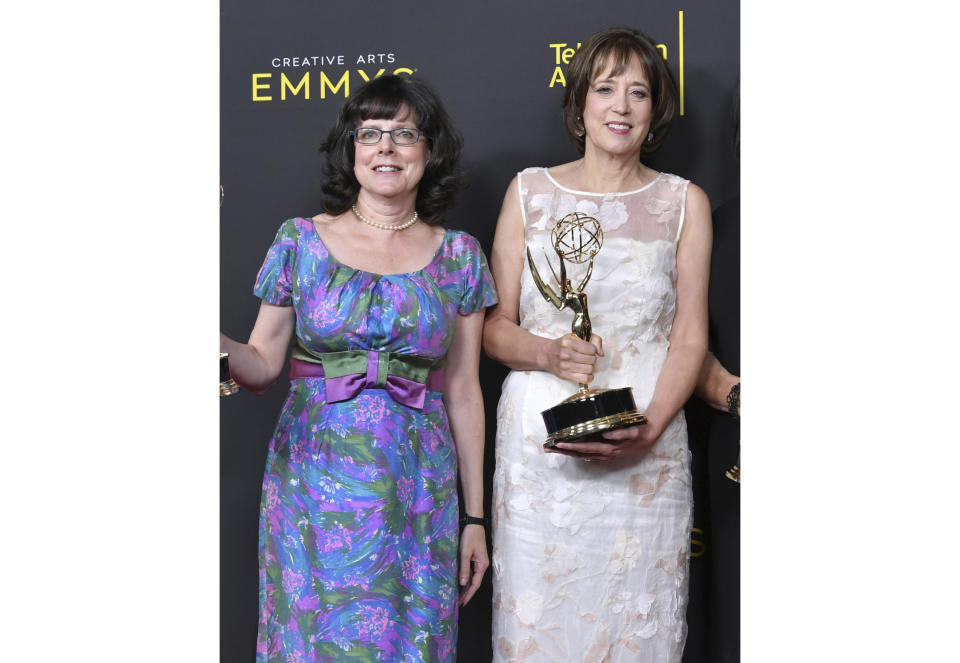 FILE - Julie Cohen, left, and Betsy West pose in the press room with their awards for exceptional merit in documentary filmmaking for "RBG" at the Creative Arts Emmy Awards in Los Angeles on Sept. 14, 2019. Their latest project, "My Name is Pauli Murray" is an official selection of the Premieres section at the 2021 Sundance Film Festival. (Photo by Richard Shotwell/Invision/AP, File)