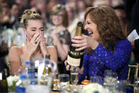 <p>The <em>I, Tonya</em> stars celebrated with some bubbly, as Robbie took home the statue for Best Actress in a Comedy and Janney for Best Supporting Actress at the the 23rd Annual Critics’ Choice Awards on Thursday night. Robbie, who was stunned by her win, told the crowd, “I was so certain this wasn’t going to happen.” (Photo: Christopher Polk/Getty Images for The Critics’ Choice Awards ) </p>