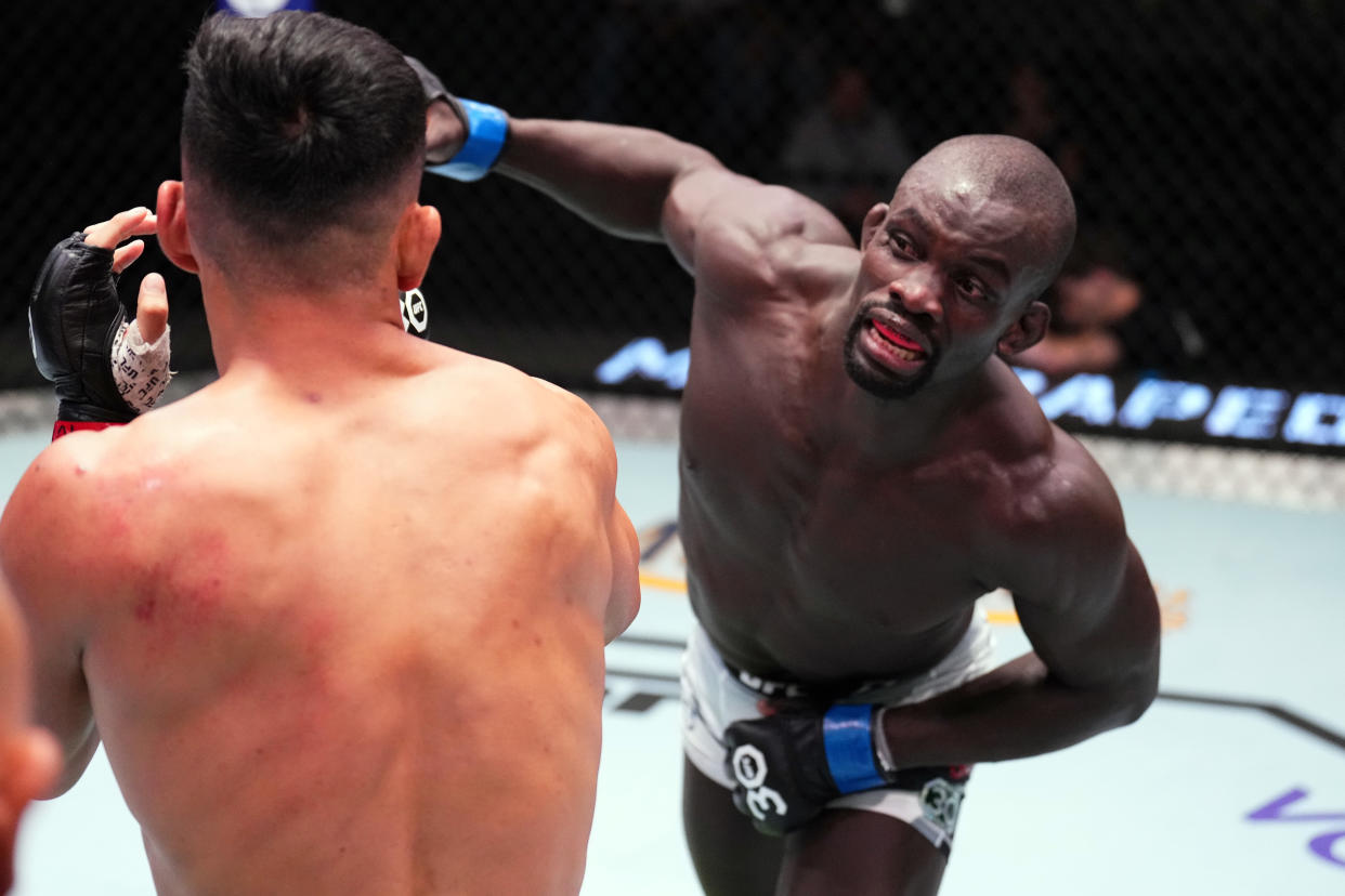 LAS VEGAS, NEVADA - MAY 20: (R-L) Themba Gorimbo of Zimbabwe punches Takashi Sato of Japan in a welterweight fight during the UFC Fight Night event at UFC APEX on May 20, 2023 in Las Vegas, Nevada. (Photo by Chris Unger/Zuffa LLC via Getty Images)