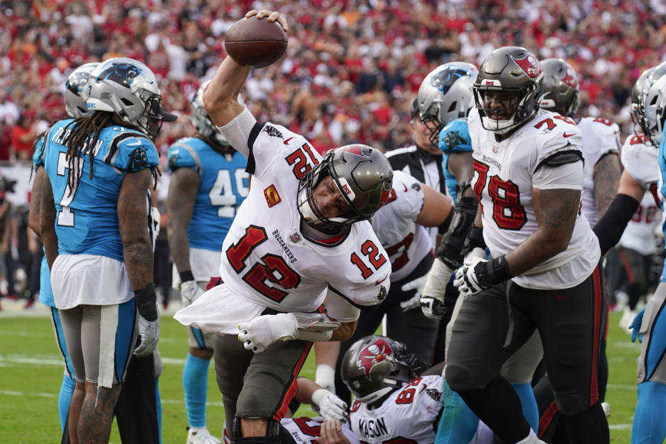 Tampa Bay Buccaneers quarterback Tom Brady celebrates after scoring during the second half of an NFL football game between the Carolina Panthers and the Tampa Bay Buccaneers on Sunday, Jan. 1, 2023, in Tampa, Fla. (AP Photo/Chris O'Meara)