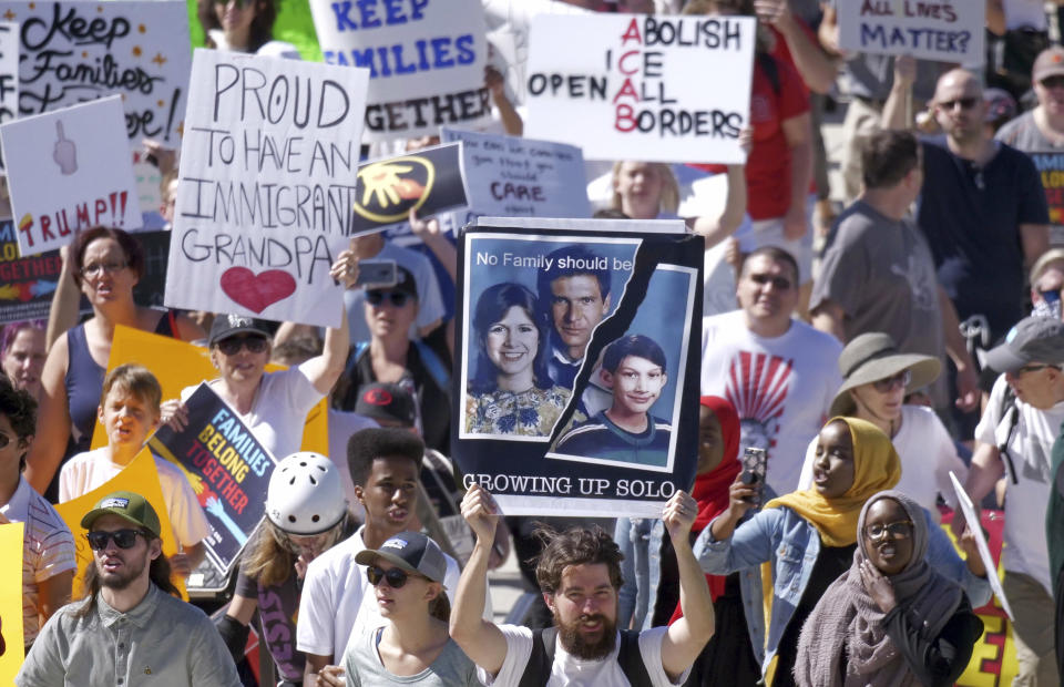 <p>Activists, including one holding a “Star Wars”-themed sign, gather during a rally to protest the Trump administration’s approach to illegal border crossings and separation of children from immigrant parents Saturday, June 30, 2018, in Salt Lake City. (Photo: Rick Bowmer/AP) </p>