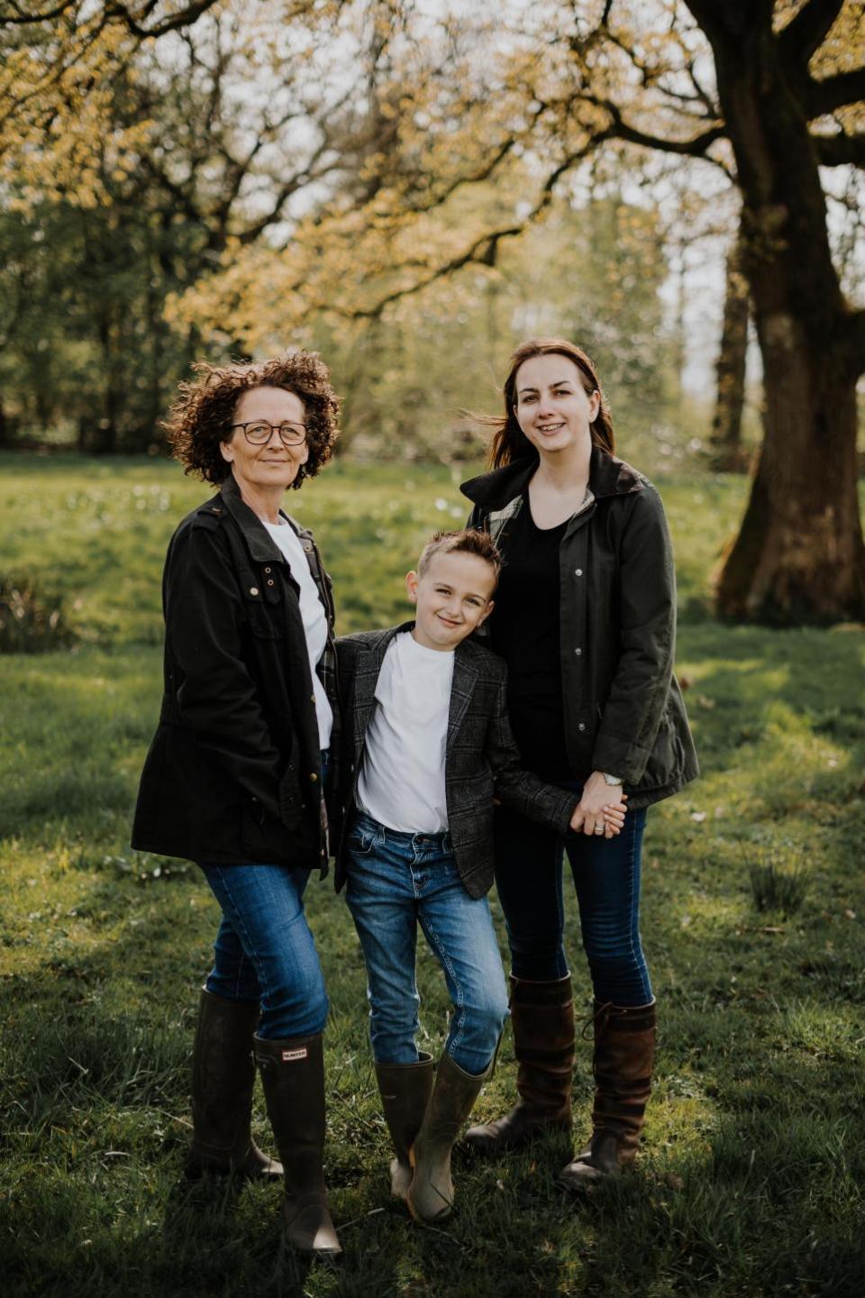 Lancashire Telegraph: Allison Metcalf (left) with her wife Lucy Metcalf (right) and their son Ralph in the Studio Bakery orchard