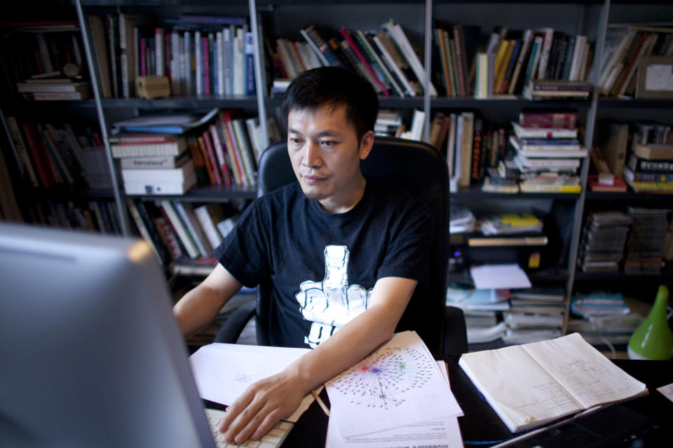 In this photo taken on July 31, 2012, Isaac Mao, a well-known Chinese blogger and the founder of Sharism Lab, a social media research group, works on a computer in Beijing. Mao had more than 30,000 users when his Weibo account was deleted in June after he made a series of questioning remarks about China's space program. (AP Photo/Alexander F. Yuan)