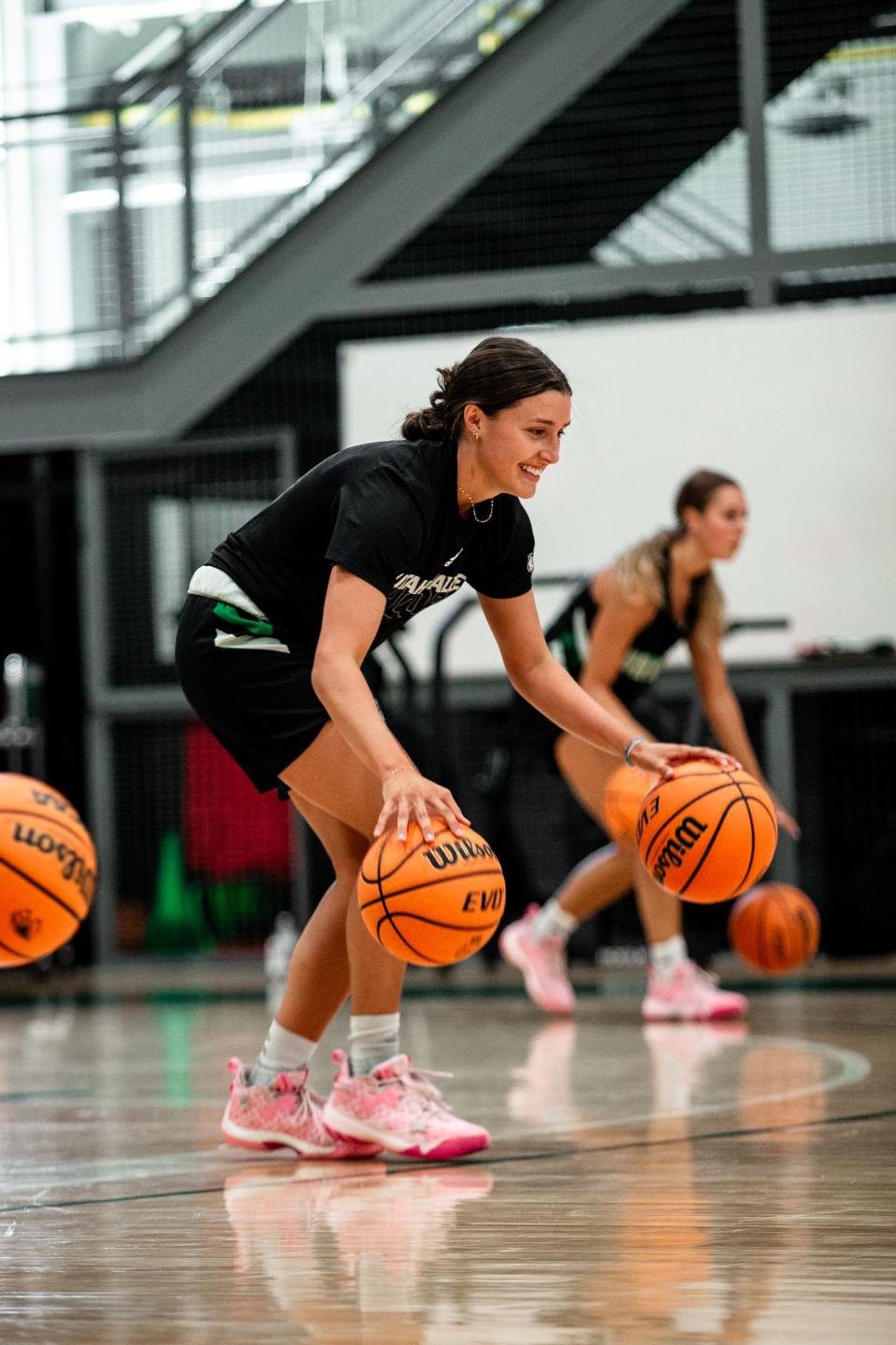 Abby Hendricks dribbling basketballs during a practice with the team. | Natalie Grover, for the Deseret News