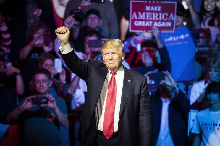 Republican presidential candidate Donald Trump waves to the crowd during a campaign rally, Thursday, Oct. 13, 2016, in Cincinnati. (Photo: John Minchillo/AP)