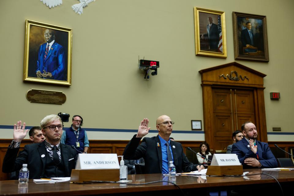 Michael Anderson, a survivor of the Club Q shooting in Colorado Springs, Matthew Haynes, the owner of Club Q, and James Slaugh a survivor of the Club Q shooting in Colorado Springs, are sworn in during a House Oversight Committee hearing titled "The Rise of Anti-LGBTQI+ Extremism and Violence in the United States" at the Rayburn House Office Building on December 14, 2022 in Washington, DC.