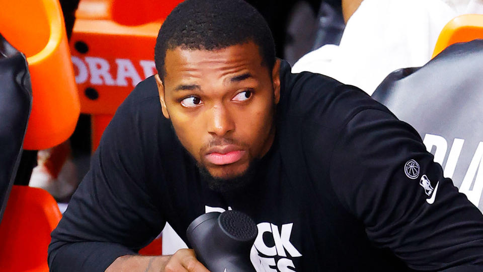 Seen here, Houston Rockets guard Sterling Brown sits down with a Black Lives Matter t-shirt on.