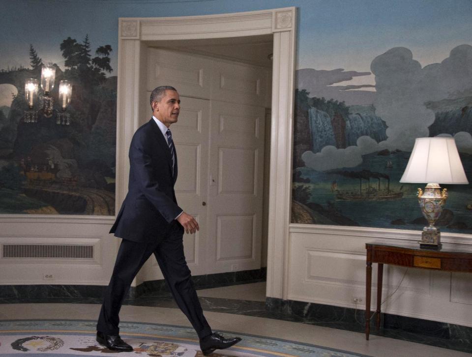 President Barack Obama arrives in the Diplomatic Room of the White House in Washington, Tuesday, Aug. 28, 2012, to talk about Tropical Storm Isaac. (AP Photo/Carolyn Kaster)