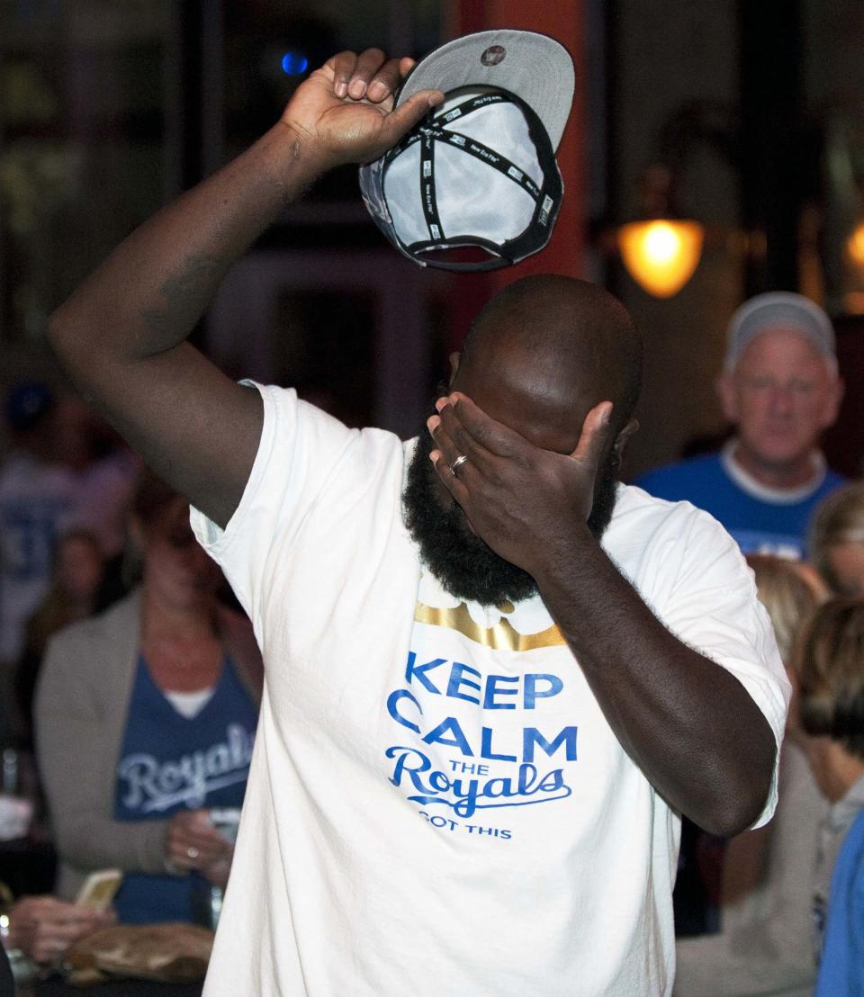 A Kansas City Royals fan reacts to their team's loss at baseball's World Series against the San Francisco Giants, during a watch party at The Kansas City Power & Light District in Kansas City, Missouri, October 29, 2014. REUTERS/Sait Serkan Gurbuz (UNITED STATES - Tags: SPORT BASEBALL)