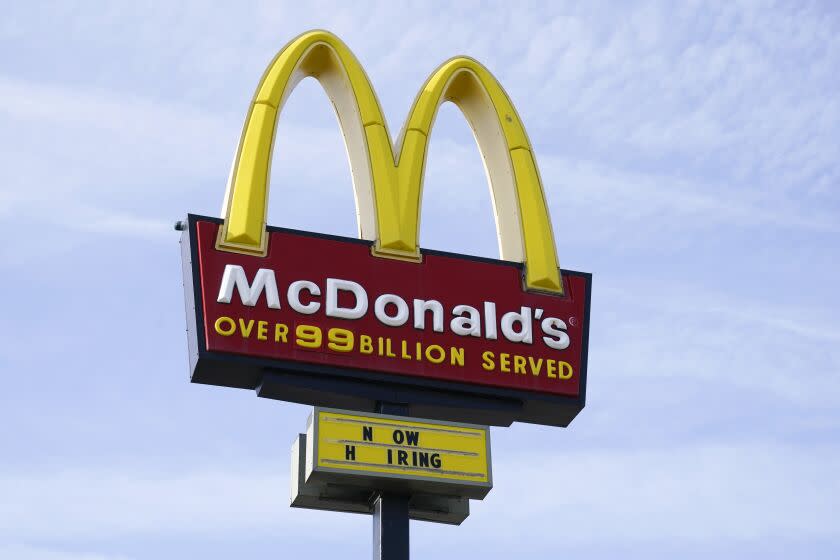 FILE - A sign is displayed outside a McDonald's restaurant, Tuesday, April 27, 2021, in Des Moines, Iowa. McDonald's said Tuesday, March 8, 2022, it is temporarily closing all of its 850 restaurants in Russia in response to the country's invasion of Ukraine. The burger giant said it will continue paying its 62,000 employees in Russia. (AP Photo/Charlie Neibergall, File)