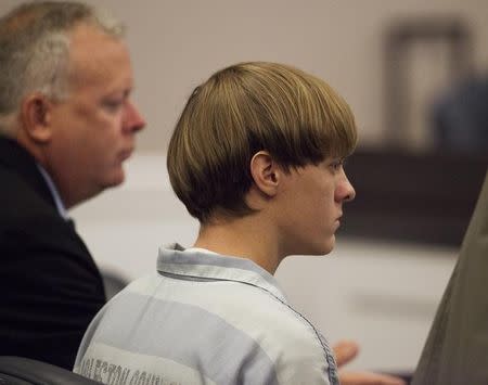 Dylann Roof (R), the 21-year-old man charged with murdering nine worshippers at a historic black church in Charleston last month, listens to the proceedings with assistant defense attorney William Maguire during a hearing at the Judicial Center in Charleston, South Carolina July 16, 2015. REUTERS/Randall Hill